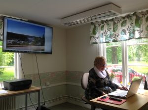 80-Year Old Cecilia browsing through her photos